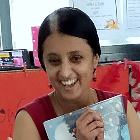 Priya Mohire, founder of Kathaवट, smiling during a story session